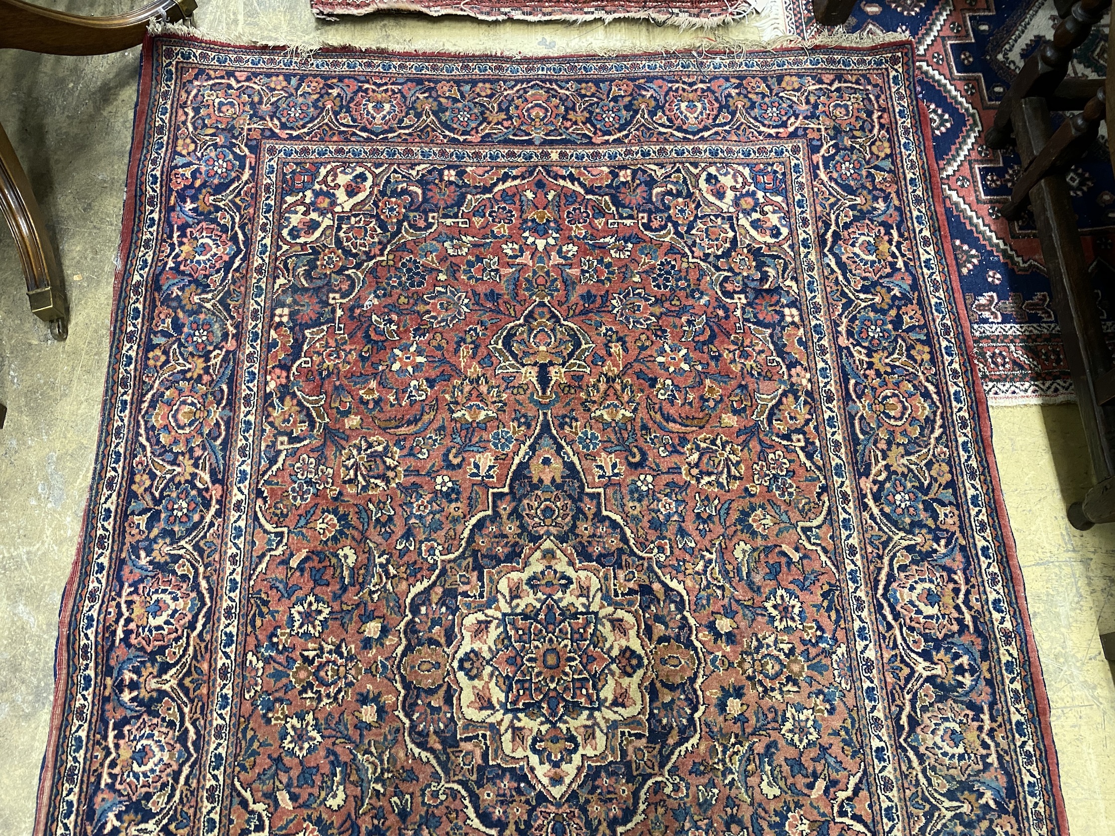 An Isphahan red ground rug, 206 x 133cm together with a Bokhara red ground runner